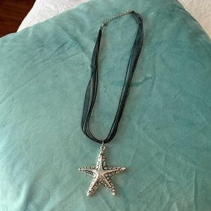 Silver and black starfish necklace